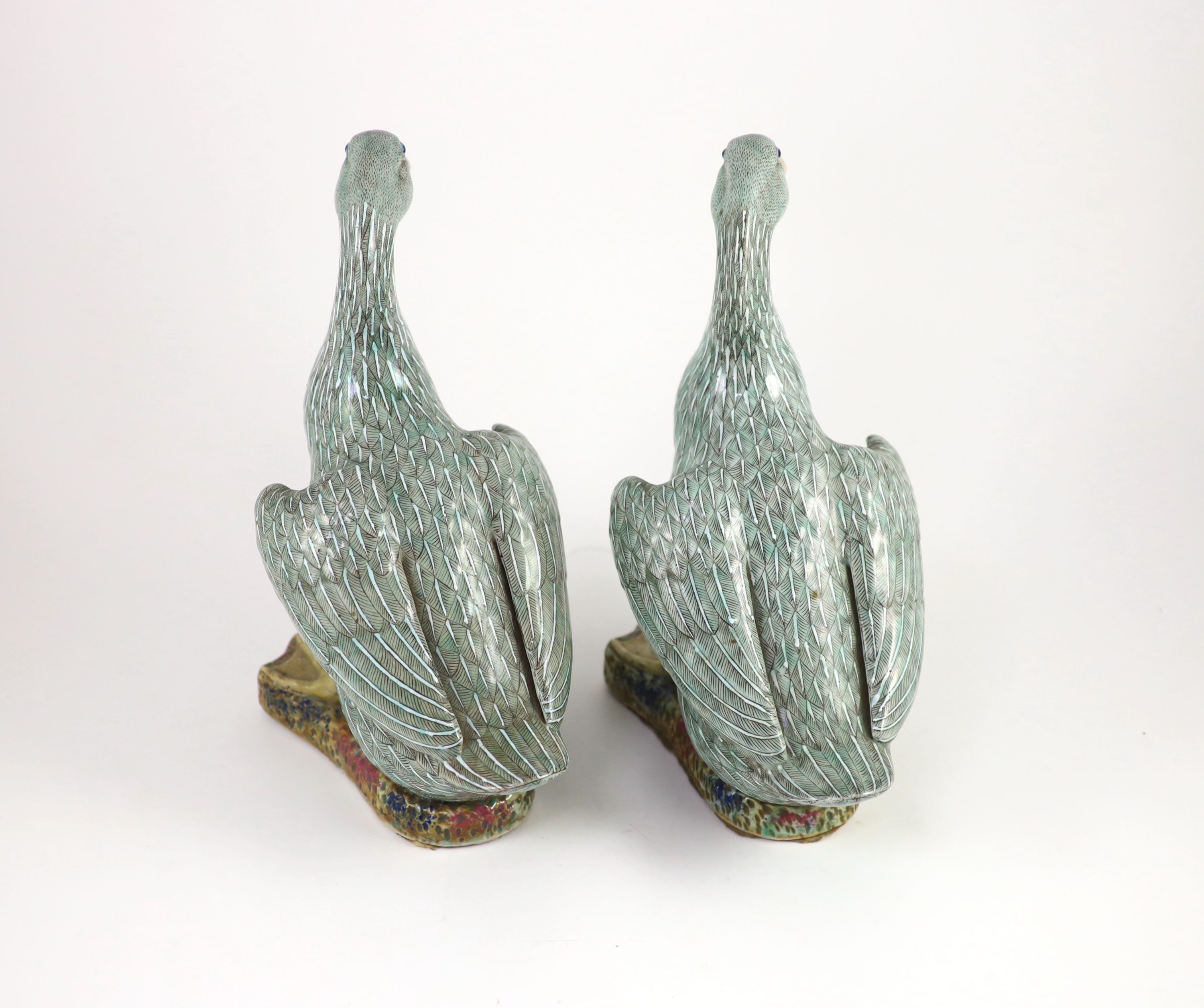 A pair of Chinese famille verte enamelled porcelain models of ducks, 19th century, 30.5 cm high